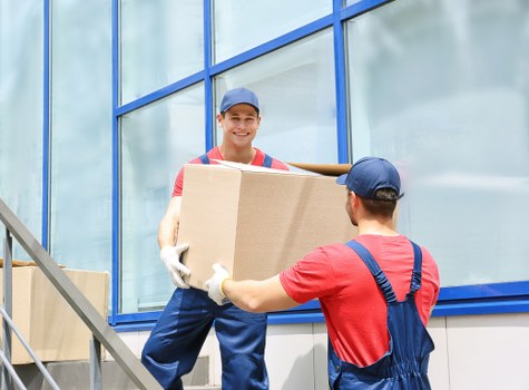 Packed moving boxes and furniture ready for truck loading