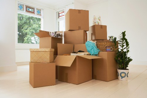 Sorting cardboard and reusable items during a South London move