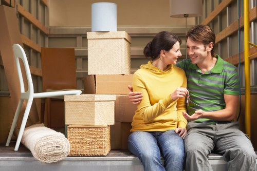 Professional movers handling furniture and boxes in Elephant And Castle flat move