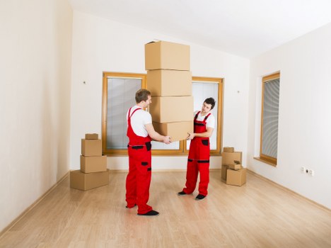 Crew loading items into a moving van with care